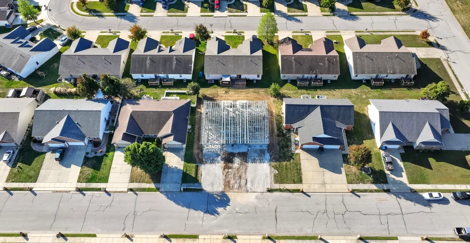 The Duo's steel frame among finished homes, from above